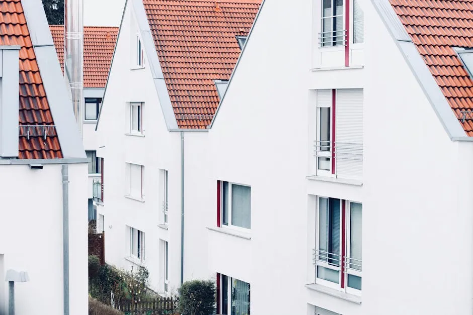 White houses with red roofs create a clean and modern suburban landscape.