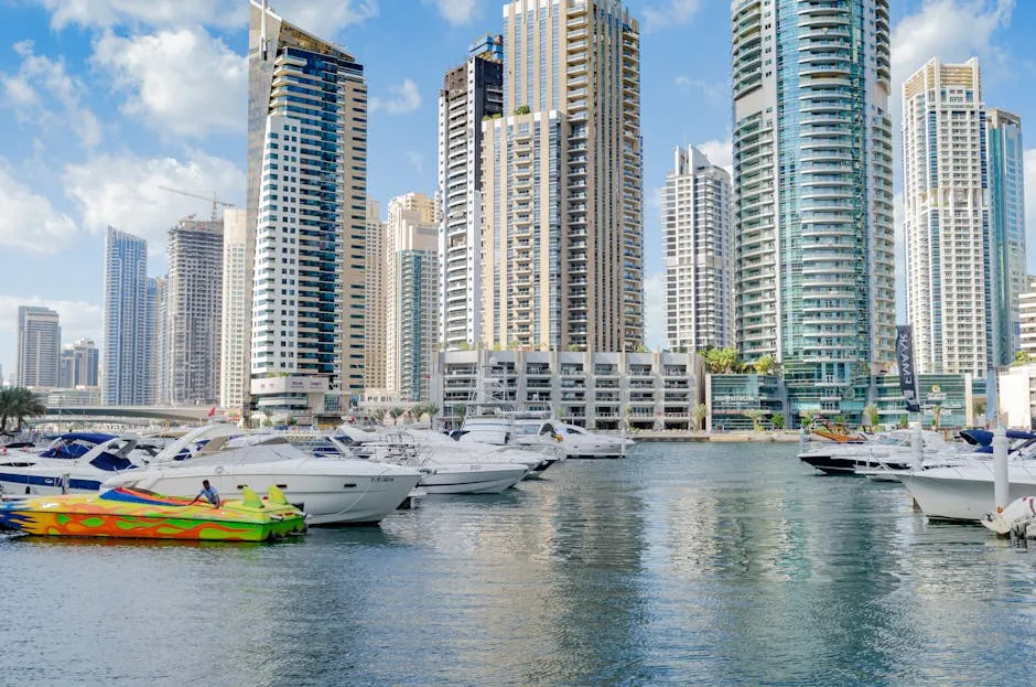 Beautiful view of Dubai Marina's modern skyline with luxury yachts docked at the harbor.