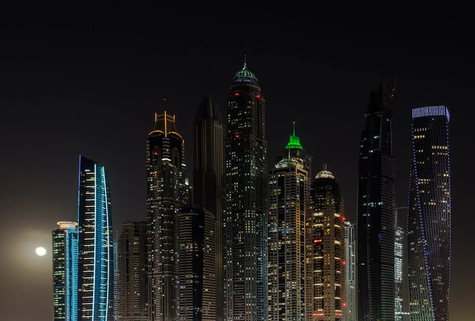 Stunning view of Dubai's illuminated skyscrapers against the night sky, capturing urban architecture.