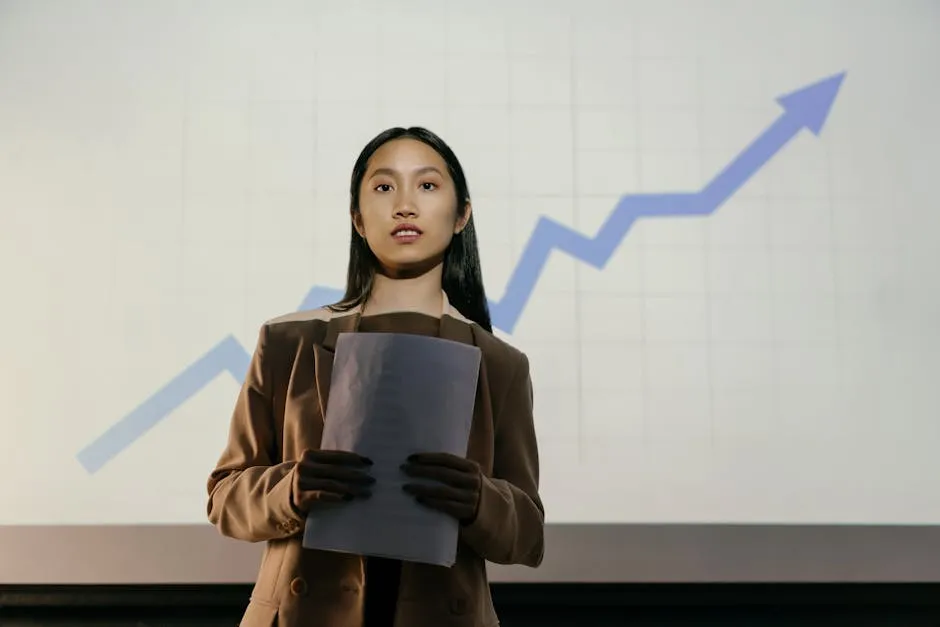 A confident businesswoman presenting a growth chart in a professional setting.